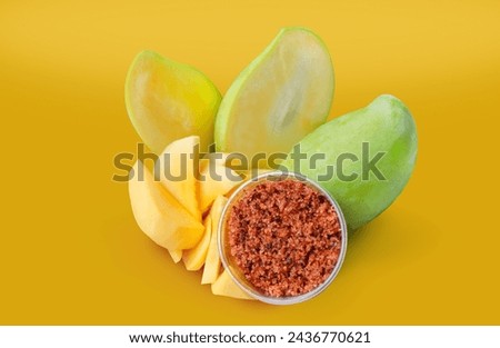 Mango, cut into bite-sized pieces yellow background , ready to eat. Ready to serve with dipping sauce, chili and salt, Thai style, Asian food. Royalty-Free Stock Photo #2436770621