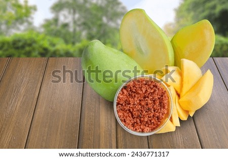 Mango, cut into bite-sized pieces, ready to eat. serve with dipping sauce, chili and salt, Thai style, Asian food. Royalty-Free Stock Photo #2436771317