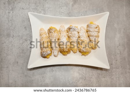 Top view of custard cream filled horns or cones.