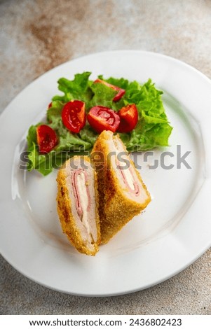 cutlet cordon bleu chicken meat, ham slice, cheese fresh food tasty eating cooking appetizer meal food snack on the table copy space food background rustic top view Royalty-Free Stock Photo #2436802423