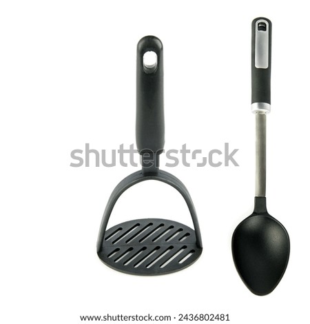 Kitchen utensils, potato masher and spoon isolated on white background. Collage. There is free space for text. Royalty-Free Stock Photo #2436802481