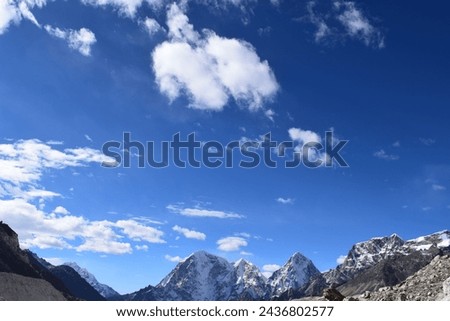 Beautiful  Valley , Green Mountains and Snow Topped Hills under Partial Cloudy and  Blue Sky in Sunny Day During the Trek to Everest Base Camp in Nepal. All Original Pictures without any Editing.