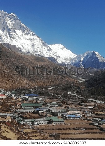 Beautiful  Valley , Green Mountains and Snow Topped Hills under Partial Cloudy and  Blue Sky in Sunny Day During the Trek to Everest Base Camp in Nepal. All Original Pictures without any Editing.