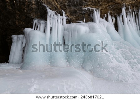 Coast of lake Baikal in winter, the deepest and largest freshwater lake by volume in the world, located in southern Siberia, Russia Royalty-Free Stock Photo #2436817021