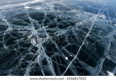 Ice of Lake Baikal, the deepest and largest freshwater lake by volume in the world, located in southern Siberia, Russia Royalty-Free Stock Photo #2436817023