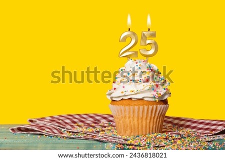 Birthday Cake With Candle Number 25 - Photo On Yellow Background.