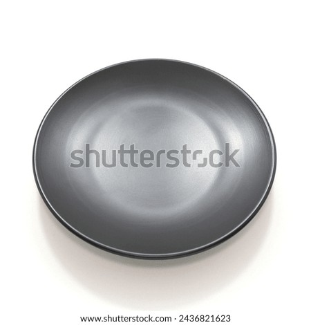 A ceramic plate isolated on white background close-up view single object concept no people  Royalty-Free Stock Photo #2436821623