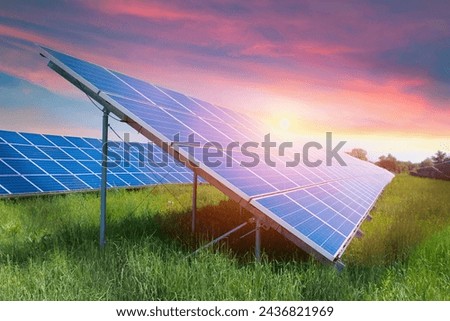 Photo collage of sunset and solar panel, photovoltaic, alternative electricity source - concept of sustainable resources. High quality photo