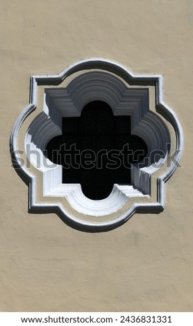 Fancy, elaborate colonial window on historic home in Antigua, Guatemala. Royalty-Free Stock Photo #2436831331