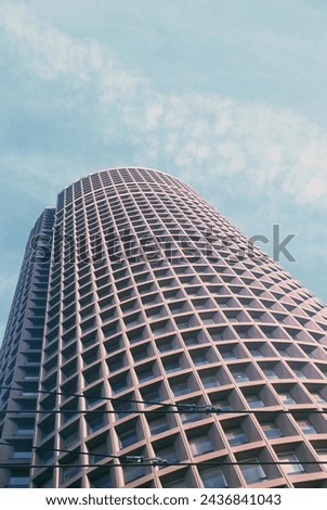 Picture of the part-dieu tower in Lyon, France. Colored analog photo.