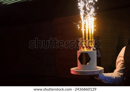 A picture of close up a wedding party cake with firework. Copy space for your text
