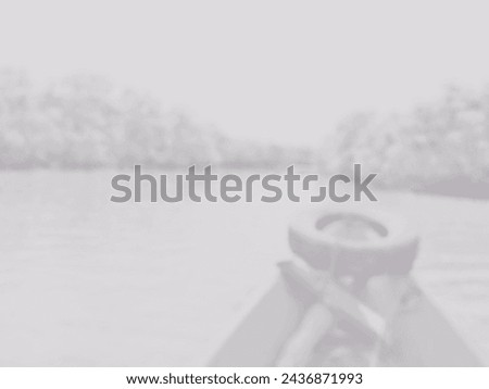 A world without color. Black and white photo of a river view with a classic aged feel. Blurred background of boat trip on river for wallpaper, banner and poster.