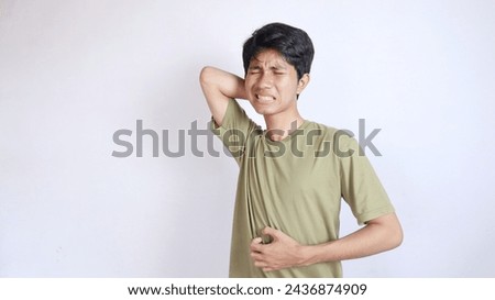 Asian man gesturing with itchy pain all over his body on an isolated white background