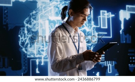 System administrator developing artificial intelligence neural networks architecture inspired by human brain. Cloud computing company executive setting up AI machine learning algorithms Royalty-Free Stock Photo #2436886799