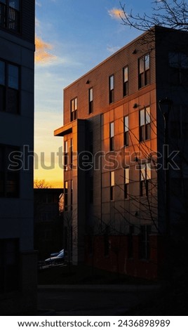 Sunset at the back of the building