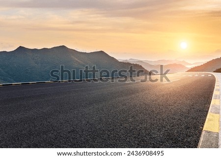 Asphalt highway road and mountain with sky clouds at sunset Royalty-Free Stock Photo #2436908495