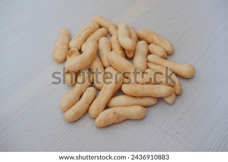 Close up of crunchy bread stick on wooden table background, stock photo