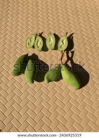 fresh cut young green mango fruit