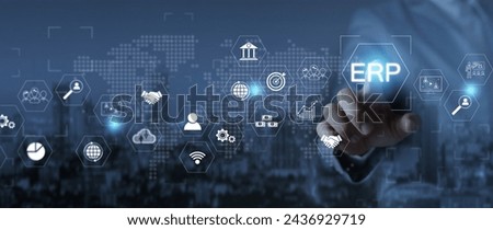 ERP enterprise resource planning system on virtual screens with business intelligence connectivity,HR and CRM businessman analyzing ERP system on monitor