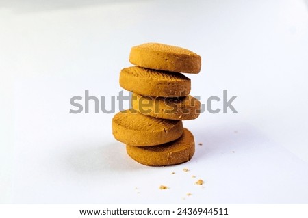 A close-up photo featuring a tempting stack of freshly baked chocolate chip cookies