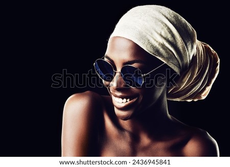 Happy, black woman and sunglasses with scarf for fashion or style on a dark studio background. Young African female person or model with smile, headwear and eyewear for stylish accessory on mockup Royalty-Free Stock Photo #2436945841