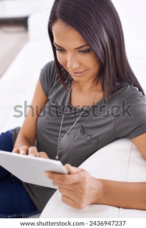 Woman, couch and tablet for browse on app in home, comfortable and website for entertainment. Female person, online and internet for blog and subscription, living room and relax on sofa for series