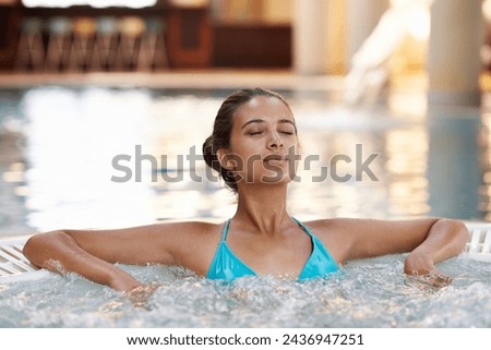 Woman, face or relax in jacuzzi at spa for luxury vacation, summer holiday or resort on weekend. Tourist, girl and confidence with rest in swimming pool for sun tan, fun getaway or wellness in bikini