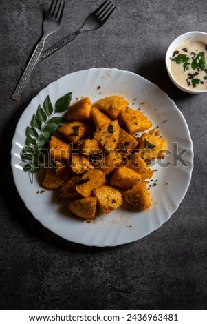 View from top of masala fried idli, a  South Indian snack dish.  Royalty-Free Stock Photo #2436963481
