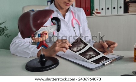 Ultrasound diagnosis of stomach and liver on abdominal cavity of in clinic. Ultrasound of liver and gallbladder cirrhosis of the liver Royalty-Free Stock Photo #2436964073