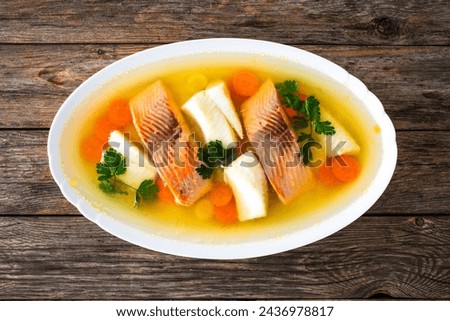 Roast salmon and halibut in jelly with vegetables on white background 