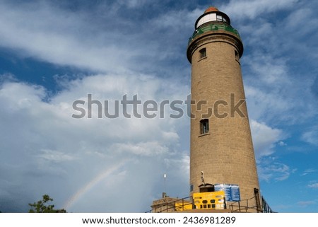 Picture of a lighthouse tower with blue sky in the background at UNESCO world heritage site of Mahabalipuram. Ajanta, Ellora, Hampi ancient stone sculpture carvings sacred pilgrimage archeology stone