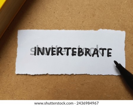 Invertebrate writting on table background. Royalty-Free Stock Photo #2436984967