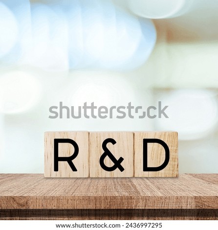 Research and development, rd word on wooden blocks over blur background, banner for business and technology concept 