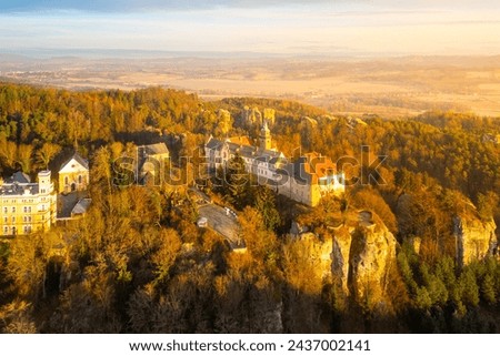Hruba Skala chateau at cold morning sunrise time. Bohemian Paradise, Czech: Cesky raj, Czechia. Aerial view from above. Royalty-Free Stock Photo #2437002141