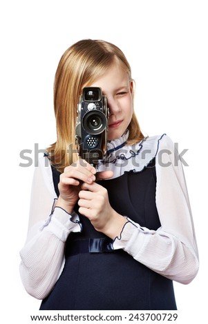Girl cameraman filming with retro camera isolated