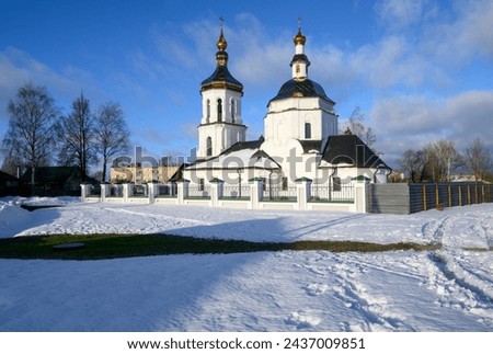 Town Bezhetsk landscape view at cold sunny winter day, white snow and ice. Tver oblast Transfiguration church, snow area near entrance and dramatic sky. Tver Oblast faith and tourism concept, Russia