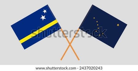 Crossed flags of Country of Curacao and the State of Alaska. Official colors. Correct proportion. Vector illustration
