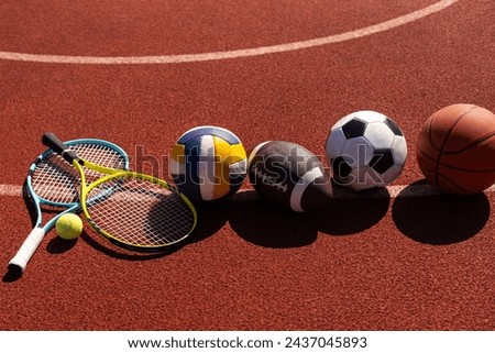 Set of sport equipment, rackets and tennis balls soccer and basketball balls