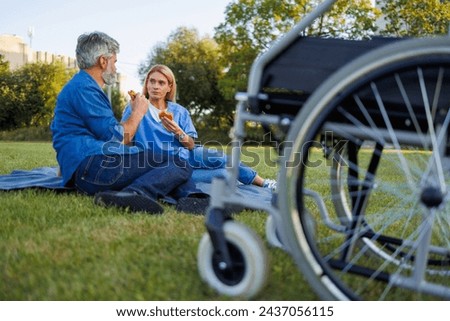 Burger break: Nurse treats patient to a sunny picnic