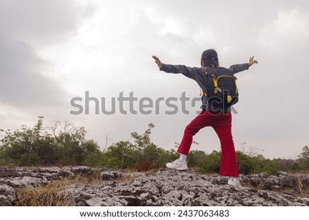 Picture of a kid girl aged 7 years and up traveling and hiking. In different poses with determined effort and determination to conquer long distances and encounter beautiful views.