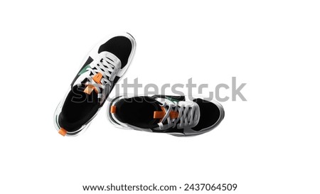 Pair of new unbranded black sport running shoes or sneakers isolated on white background with clipping path. High quality photo