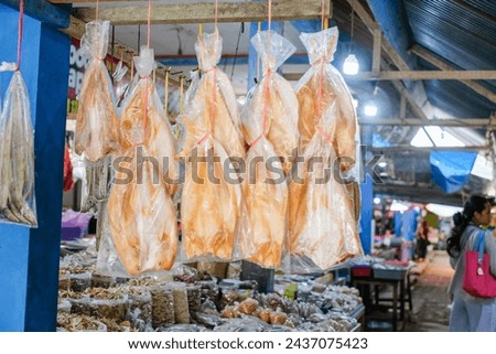 Salted fish or dried fish is fish that is preserved by salting and drying in the sun. It is being sold at fish markets. This is a famous traditional side dish in Indonesia.