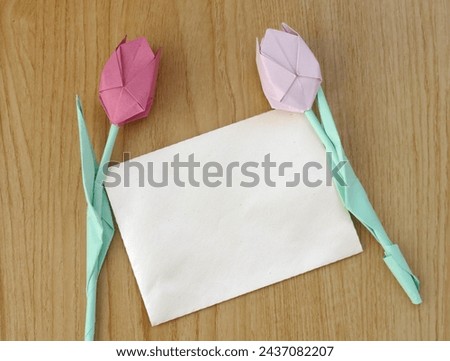 White note mock up with pastel paper tulips