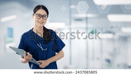 Female doctor holding clipboard standing in a hospital, Medical and health care concept.