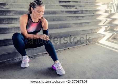 Cropped shot of a sporty young woman suffering from a knee injury. A beautiful sportswoman struggling with a knee injury.