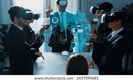 Smart manager using VR glass to connect global networking connection with hologram of big data and digital screen flowing while team programing system. Cloud and security data protection. Directorate.
