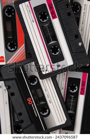Close-up of many audio tapes. Analog storage medium. Cassettes for audio recordings and music. Vintage music background.