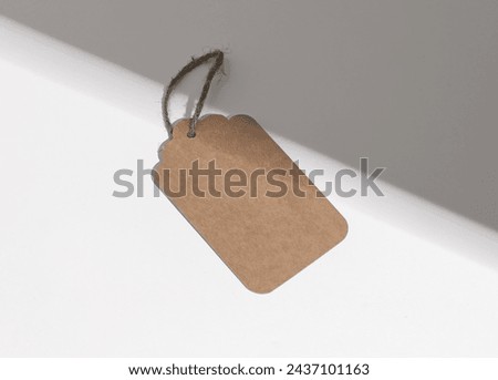 Kraft paper tag, carton label, sale blank card on rope, twine.