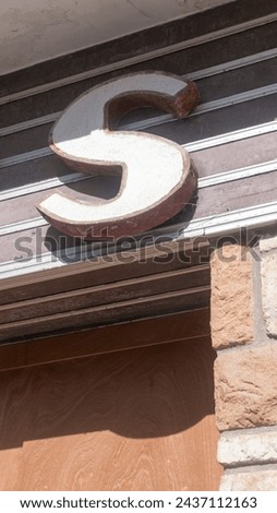 Letter S in a shop sign