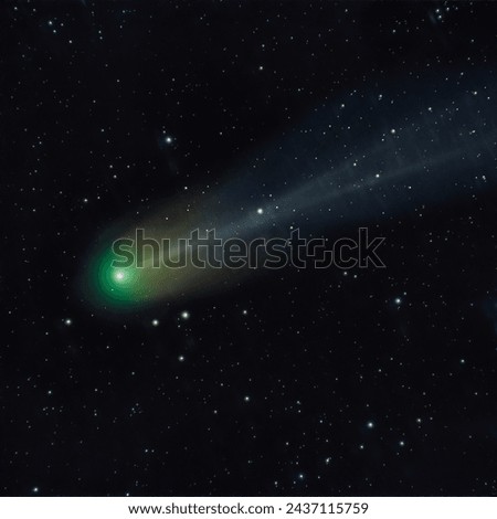 Astrophoto of periodic comet 12P Pons Brooks in the night sky. Green nucleus and tail of ion, dust and  Royalty-Free Stock Photo #2437115759